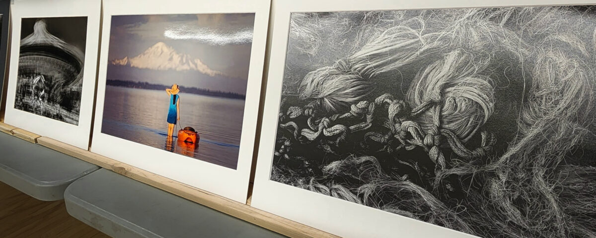 image of photographic prints propped on a table