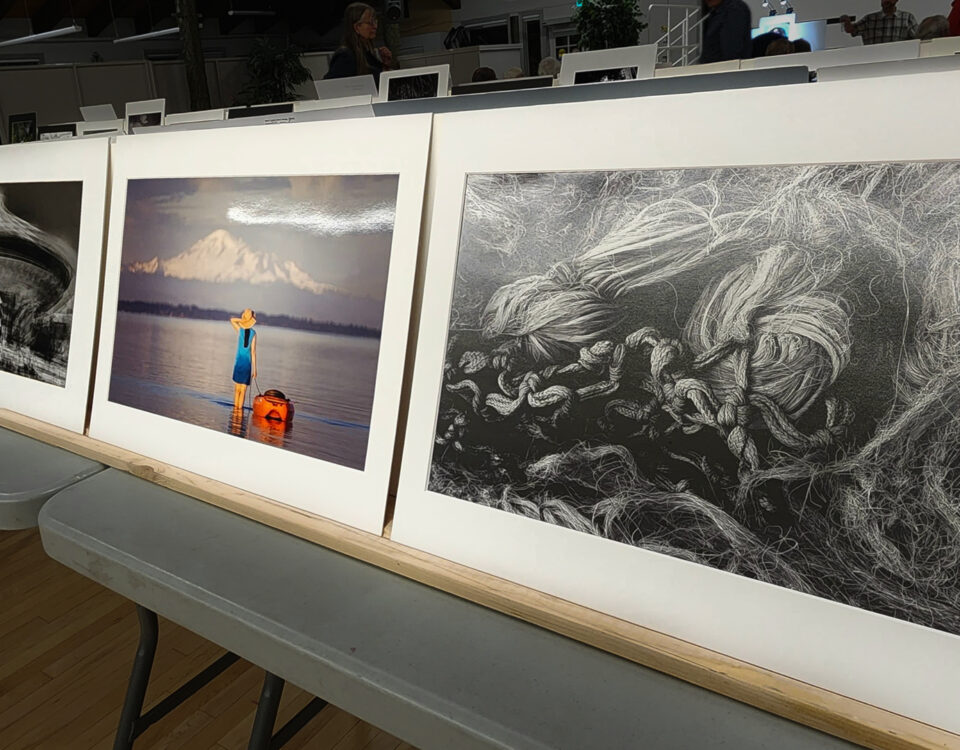 image of photographic prints propped on a table